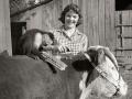 â€œKo-Koâ€? the hired hand helping a 4-Her groom a heifer in 1957, Image by John McKinney